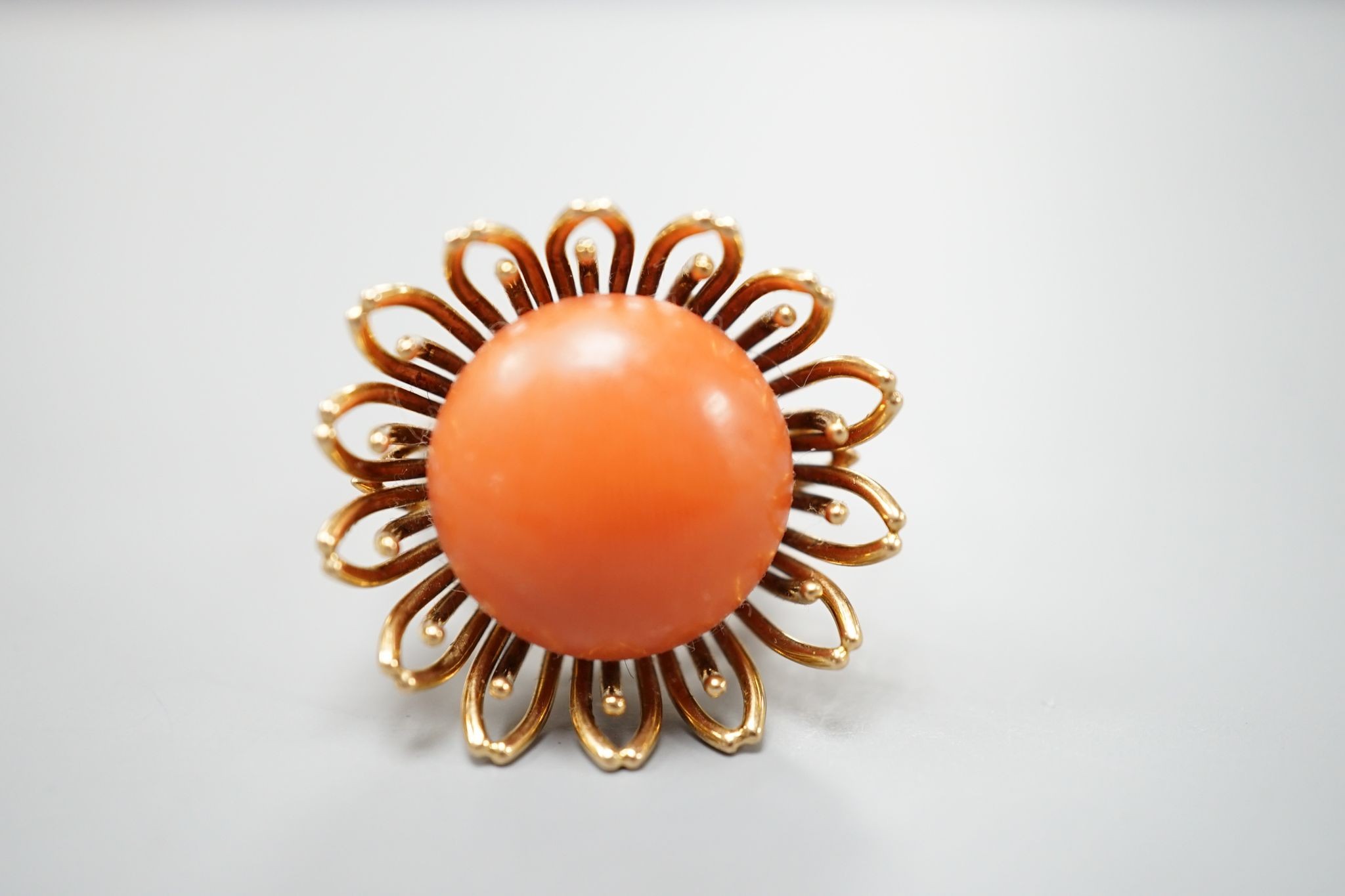 A modern yellow metal and button shaped coral bead set dress ring, size L, gross weight 13.4 grams.